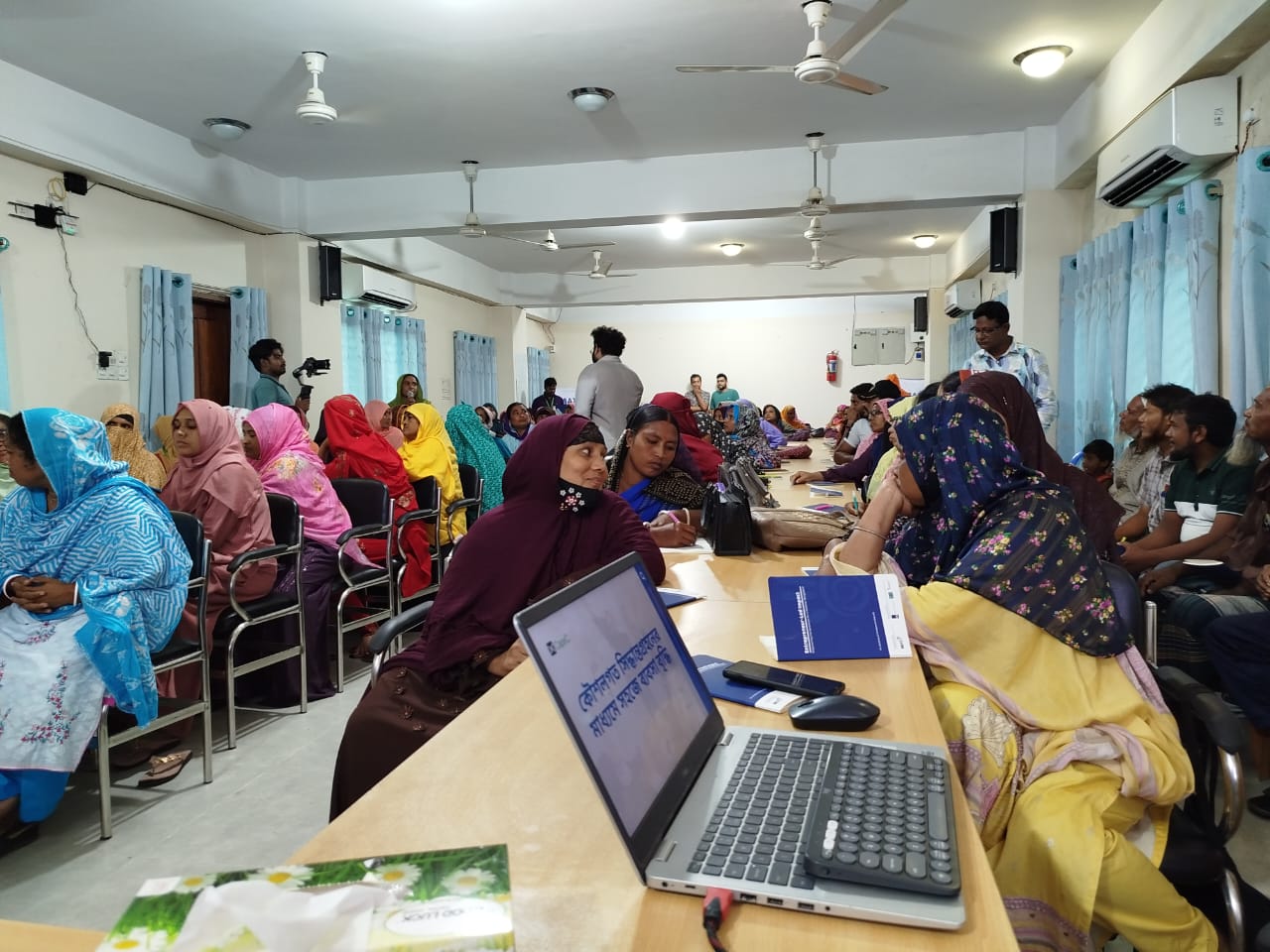 Bangladeshi entrepreneurs working together at a learning session